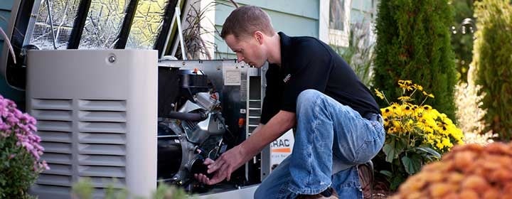 Technician performing preventive maintenance on a Generac generator in Jamestown to ensure year-round performance
